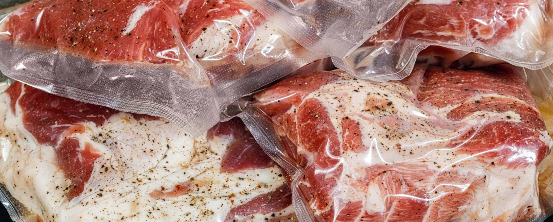 Meat packaged with roll stock material