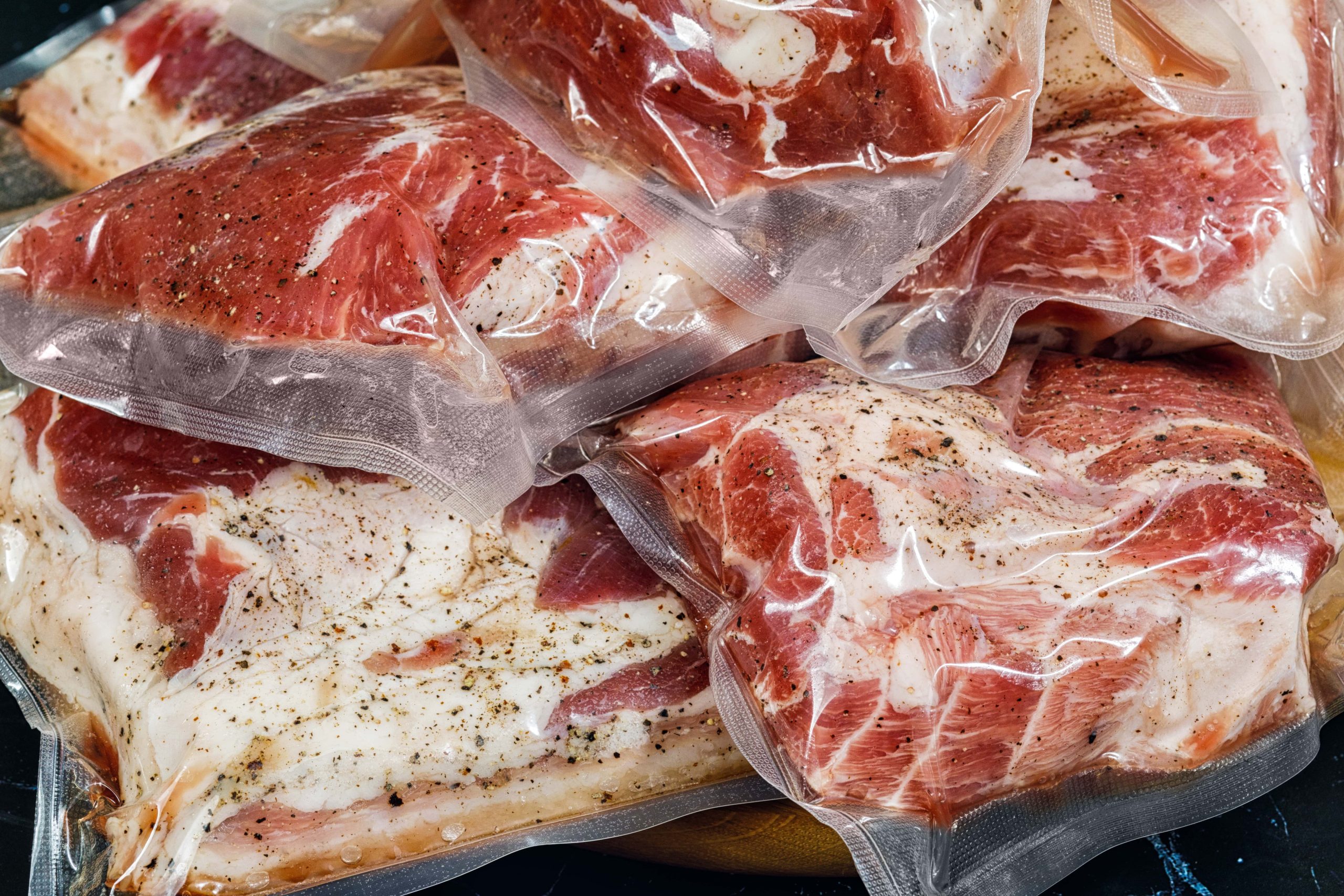 Meat packaged with roll stock material