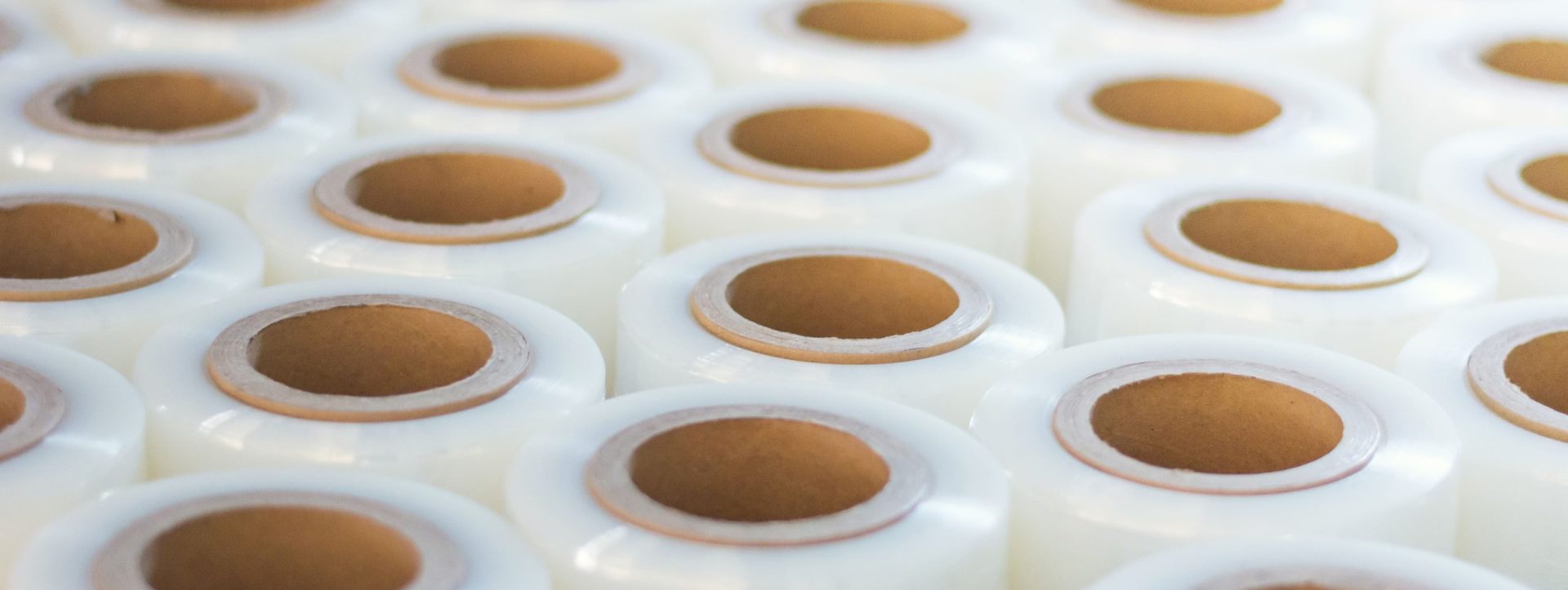 Rows and rows of roll stock in a warehouse