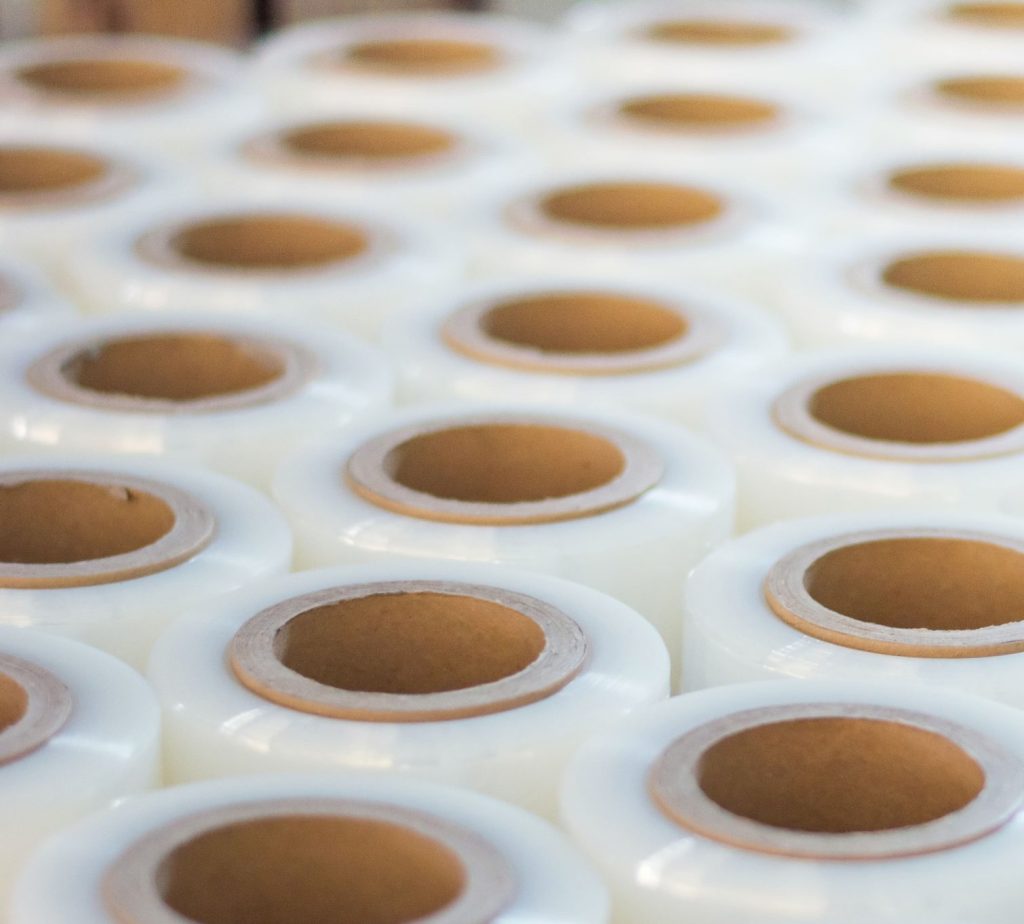 Rows and rows of roll stock in a warehouse